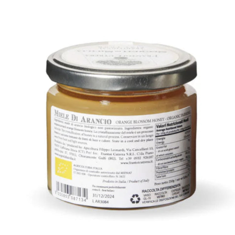 Jar of honey with a label on a white background